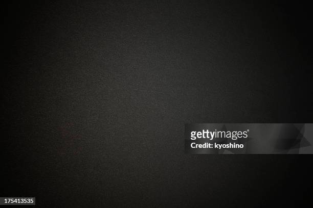 fondo de textura de papel de color negro con spotlight - textura gris fotografías e imágenes de stock