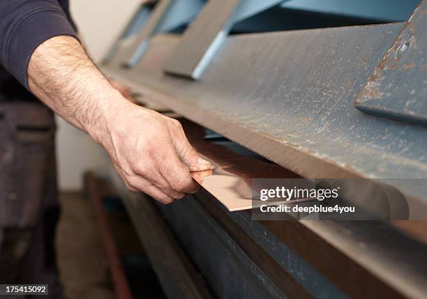 working on the sheet metal bender - griddle stock pictures, royalty-free photos & images