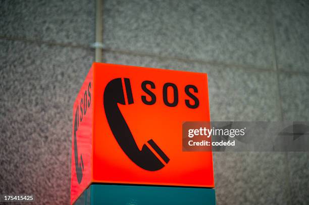 sos emergency phone sign - sos stock pictures, royalty-free photos & images