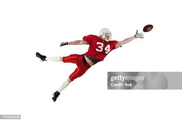 american football player in action - american football player studio stock pictures, royalty-free photos & images