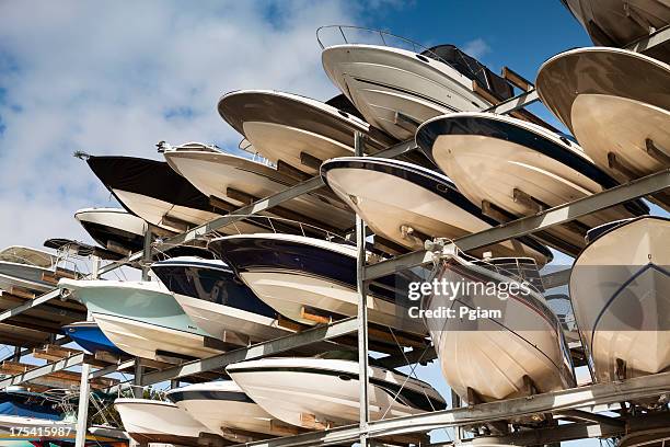 boats in storage at a marina - storage compartment stock pictures, royalty-free photos & images