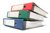Stack of Three Colored Ring Binders