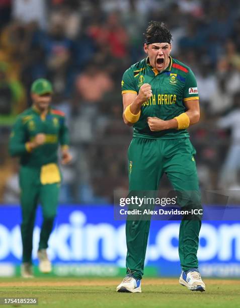 Gerald Coetzee of South Africa celebrates the wicket of Mushfiqur Rahim of Bangladesh during the ICC Men's Cricket World Cup India 2023 between South...