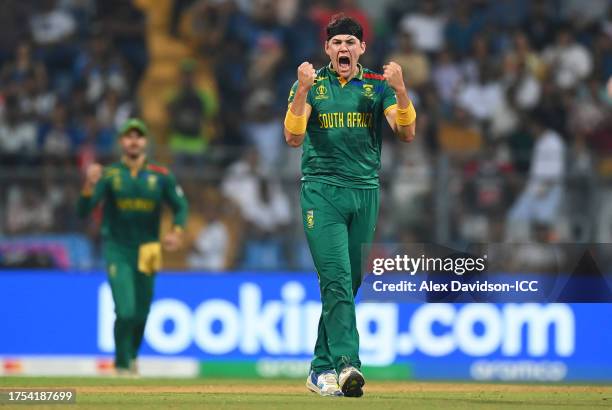 Gerald Coetzee of South Africa celebrates the wicket of Mushfiqur Rahim of Bangladesh during the ICC Men's Cricket World Cup India 2023 between South...