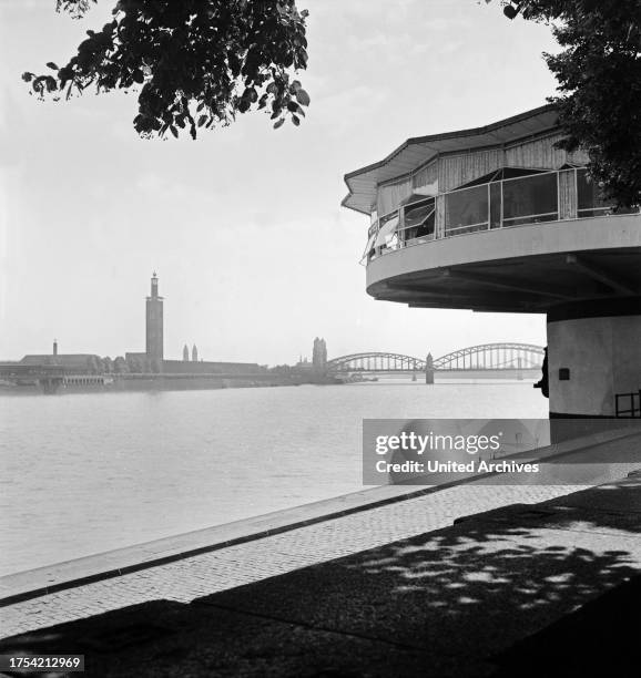 View from the Bastei southward to Hohenzollernbruecke and fair buildings with tower, Cologne 1930s.