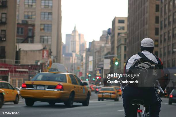 bicycle messenger - street light post stock pictures, royalty-free photos & images
