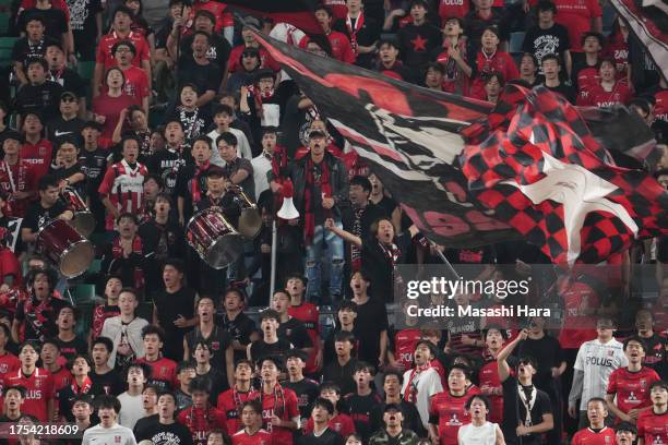 Supporters of Urawa Reds cheer during the AFC Champions League Group J match between Urawa Red Diamonds and Pohang Steelers at Saitama Stadium on...