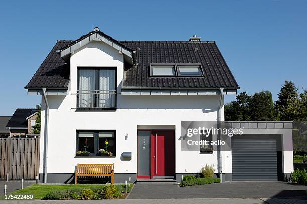 cute one-family house with garage - family front door stock pictures, royalty-free photos & images