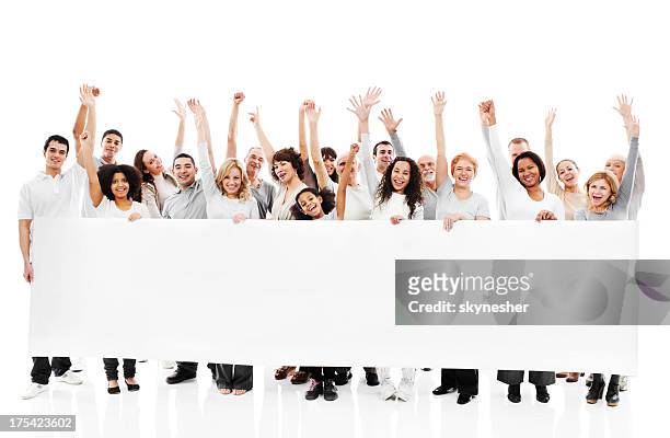 large group of happy people holding a white board. - armen omhoog stockfoto's en -beelden