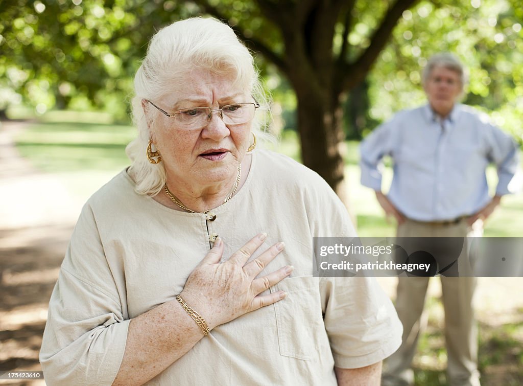 Elderly woman feeling pain in her chest