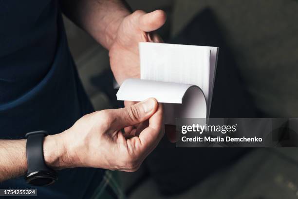 male reads user manual for computer parts - bedienungsanleitung stock-fotos und bilder