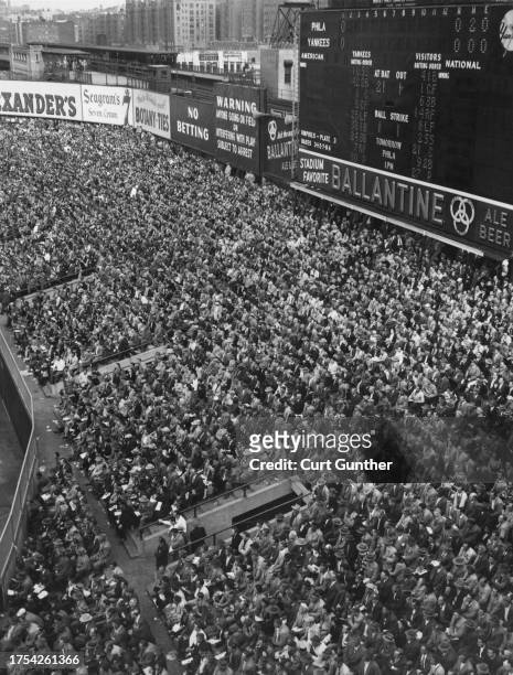 Spectators look on from the center field bleachers during Game 3 of the 1950 MLB World Series between the American League New York Yankees and the...