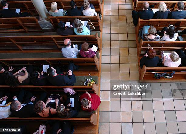 congregation at church praying - christian spirituality stock pictures, royalty-free photos & images