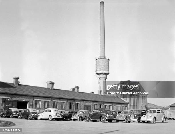 Different models of Ford parking in front of a garage at Mannheim, Germany 1930s.