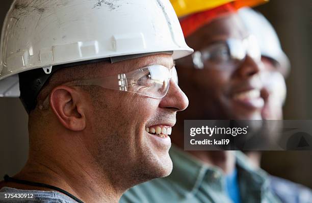 close up group of construction workers - safety glasses stock pictures, royalty-free photos & images