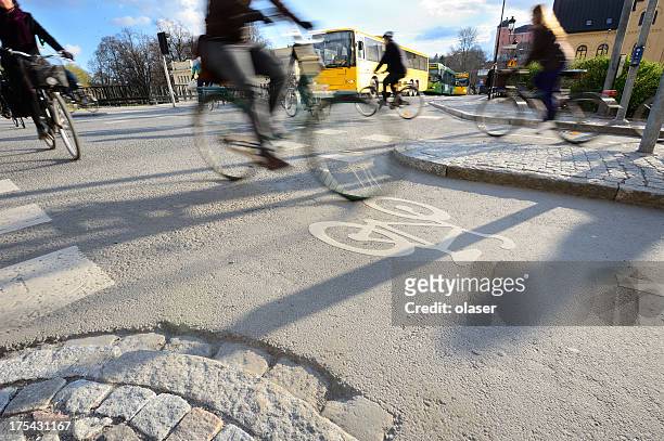 motion blurred bikes - bus lane stockfoto's en -beelden