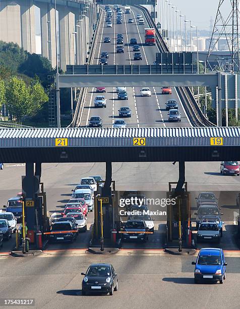 busy toll bridge on a sunny day  - tolls stock pictures, royalty-free photos & images