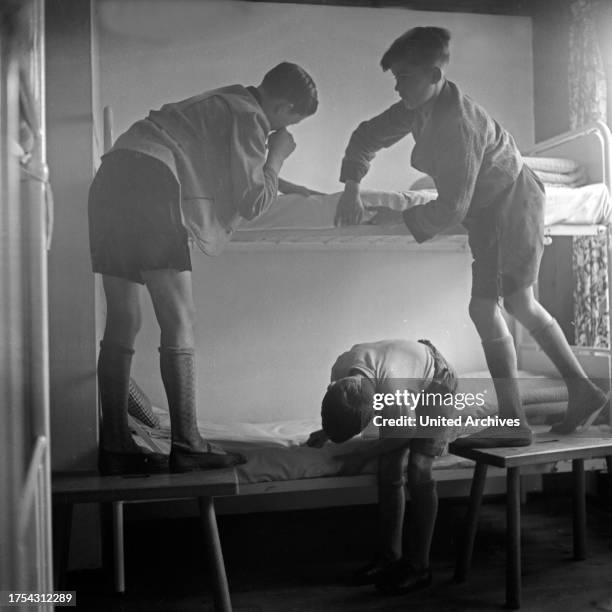 Boys at the Adolf-Hitler-youth hostel at Berchtesgaden preparing their beds, Germany 1930s.