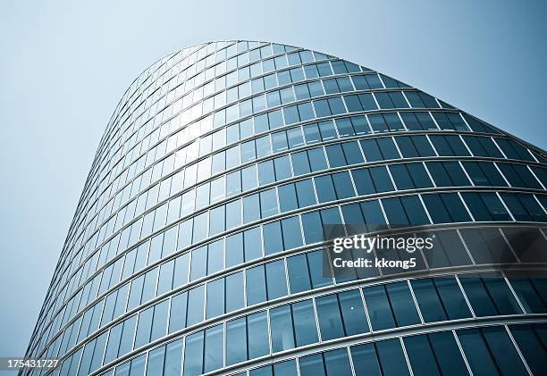 london architecture: classic modern bent building facade - london buildings stock pictures, royalty-free photos & images