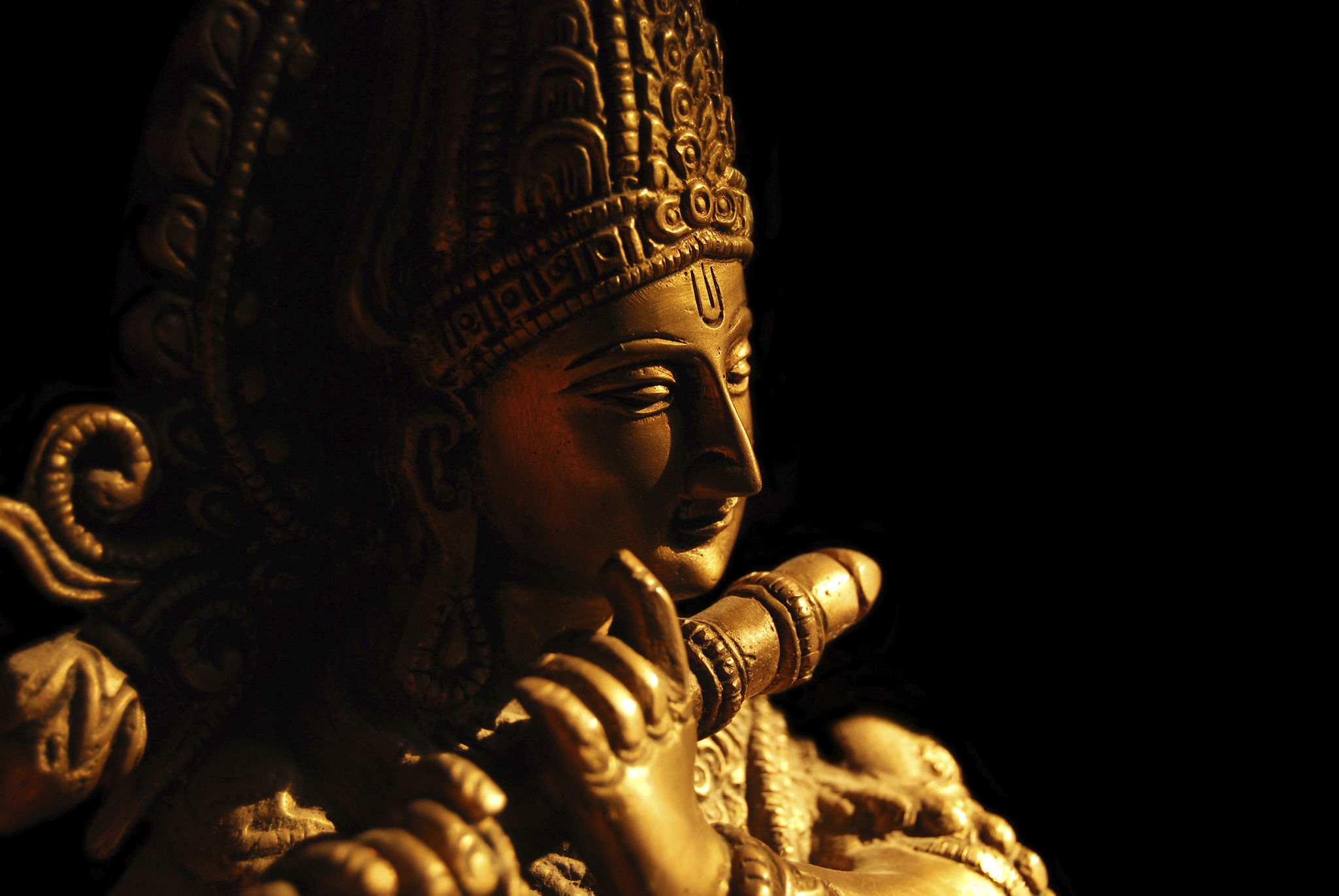 Statue of the Hindu God Krishna playing a flute Statue of the Hindu God Krishna playing a flute