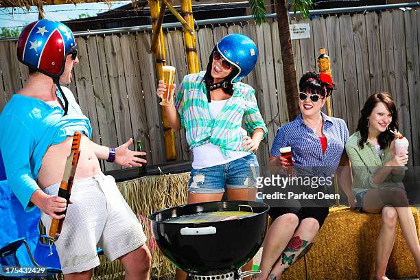funny group grill out- woman looking at man's belly - beer helmet stock pictures, royalty-free photos & images