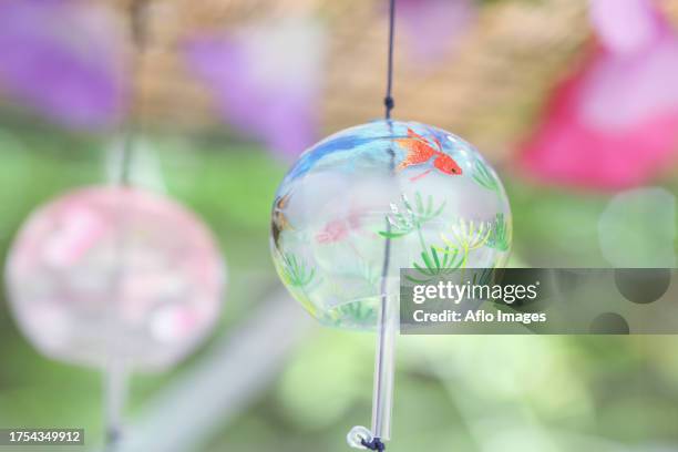 wind chime - shaking hangs stock pictures, royalty-free photos & images