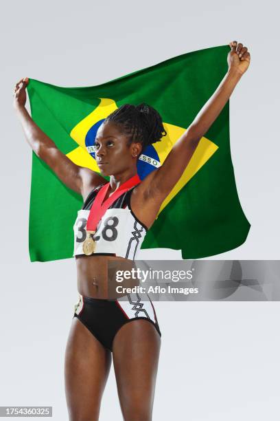 female athlete holding a brazilian flag - life after stroke awards 2011 stock pictures, royalty-free photos & images