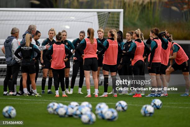 Germany Women's head coach Horst Hrubesch addresses his team during a Germany Women's training session at DFB Campus on October 24, 2023 in Frankfurt...