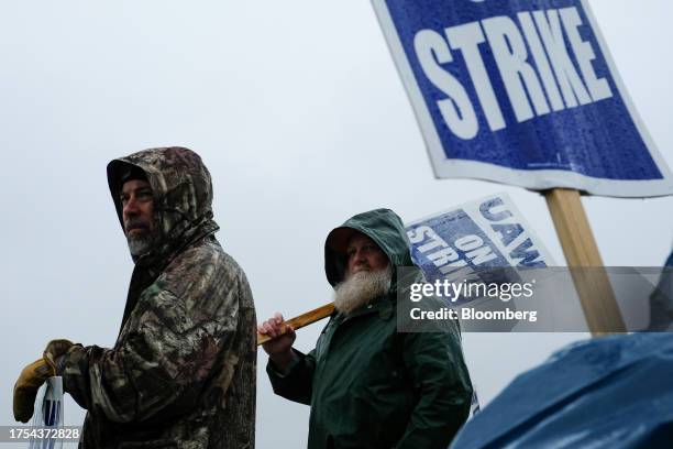On Strike" sign held on a picket line outside the General Motors Co. Spring Hill Manufacturing plant in Spring Hill, Tennessee, US, on Monday, Oct....