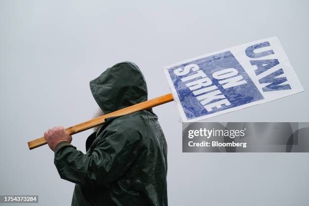 On Strike" sign held on a picket line outside the General Motors Co. Spring Hill Manufacturing plant in Spring Hill, Tennessee, US, on Monday, Oct....