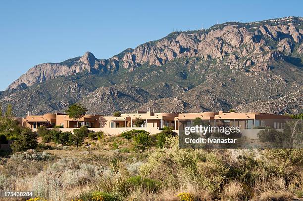 high desert community with modern southwest adobe houses - adobe stock pictures, royalty-free photos & images