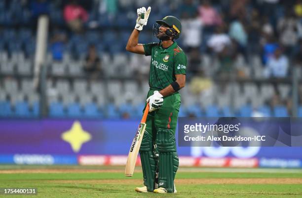 Mahmudullah of Bangladesh celebrates their century during the ICC Men's Cricket World Cup India 2023 between South Africa and Bangladesh at Wankhede...