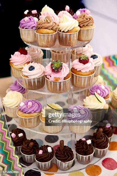 colorful cupcakes on tray - variety stockfoto's en -beelden