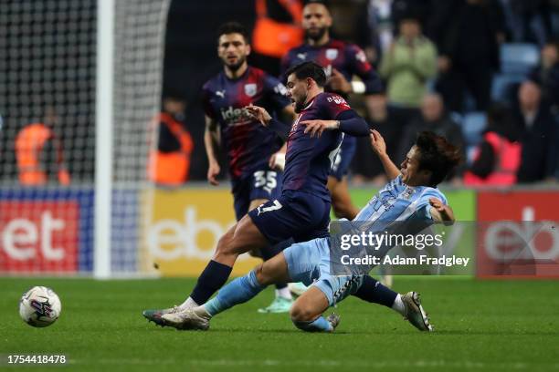 Alex Mowatt of West Bromwich Albion and Tatsuhiro Sakamoto of Coventry City during the Sky Bet Championship match between Coventry City and West...