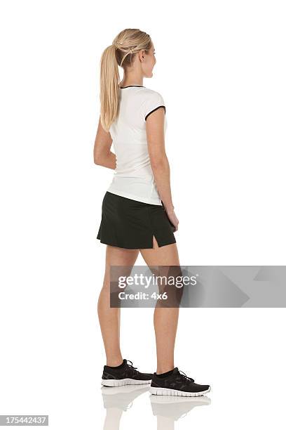 profile of a tennis player standing - white skirt stock pictures, royalty-free photos & images