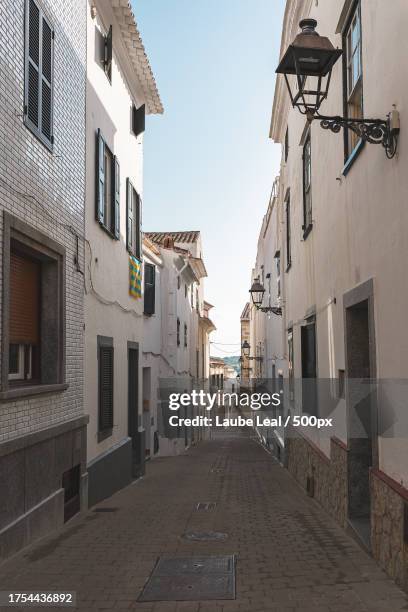 empty alley amidst buildings in city - viajes stock pictures, royalty-free photos & images