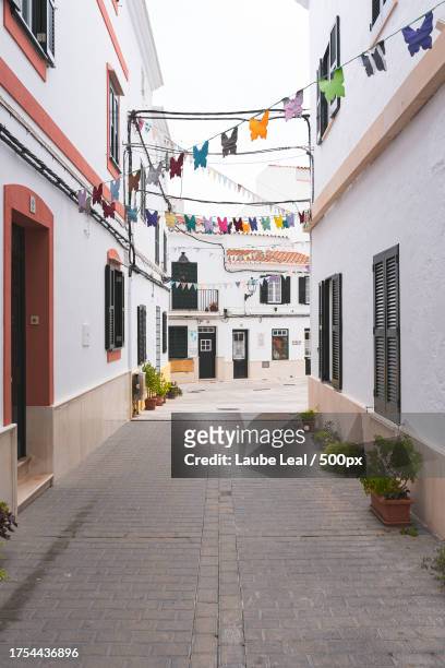 empty alley amidst buildings in city - viajes stock pictures, royalty-free photos & images