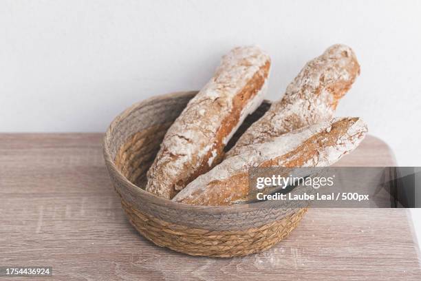 close-up of breads in basket on table - bocata stock pictures, royalty-free photos & images