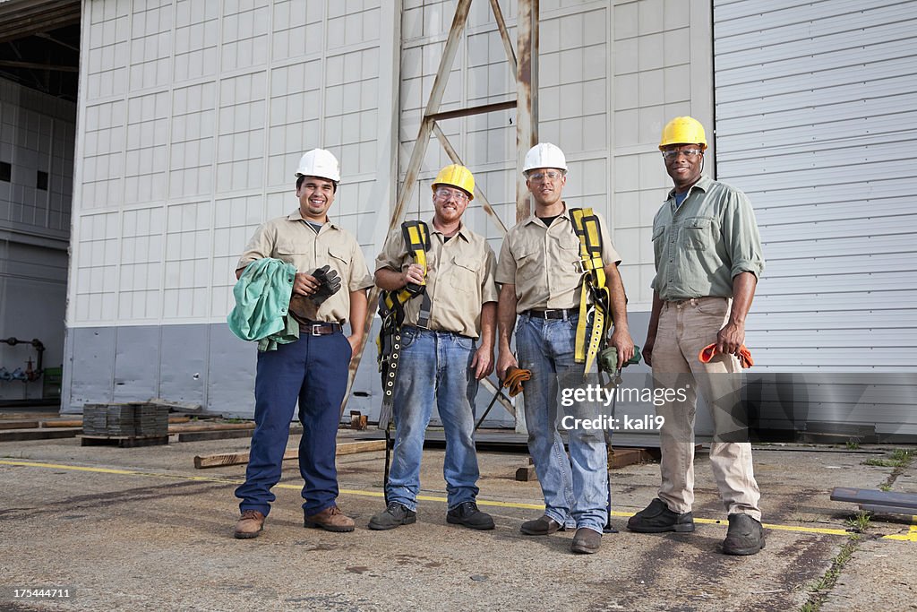 Team of construction workers with harnesses