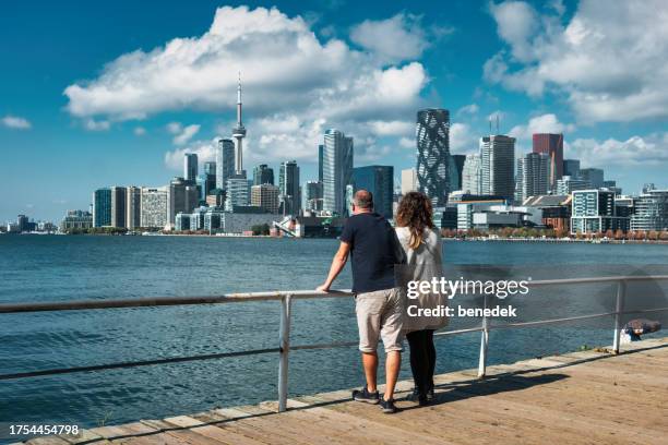 downtown toronto waterfront skyline couple - daily life in toronto stock pictures, royalty-free photos & images