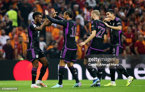 Kingsley Coman of Bayern Munich celebrates with teammates after scoring the team's first goal during the UEFA Champions League match between...