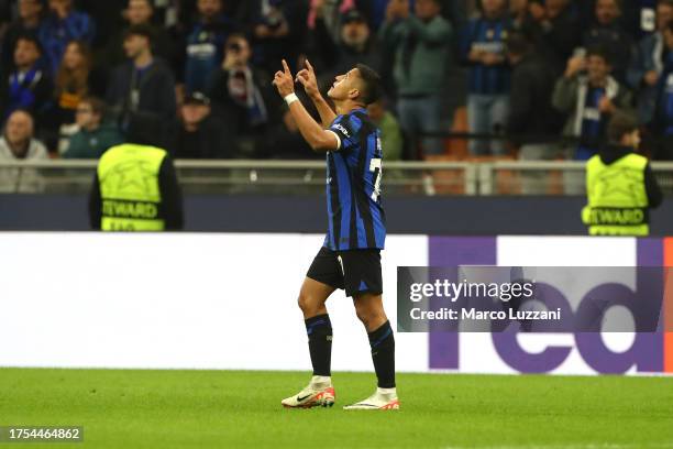 Alexis Sanchez of FC Internazionale celebrates after scoring the team's first goal during the UEFA Champions League match between FC Internazionale...