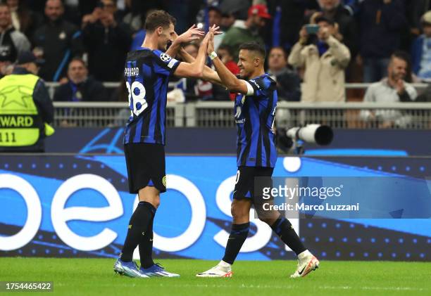 Alexis Sanchez of FC Internazionale celebrates after scoring the team's first goal during the UEFA Champions League match between FC Internazionale...
