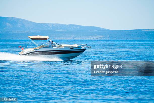 speeding power boat - speedboat stock pictures, royalty-free photos & images