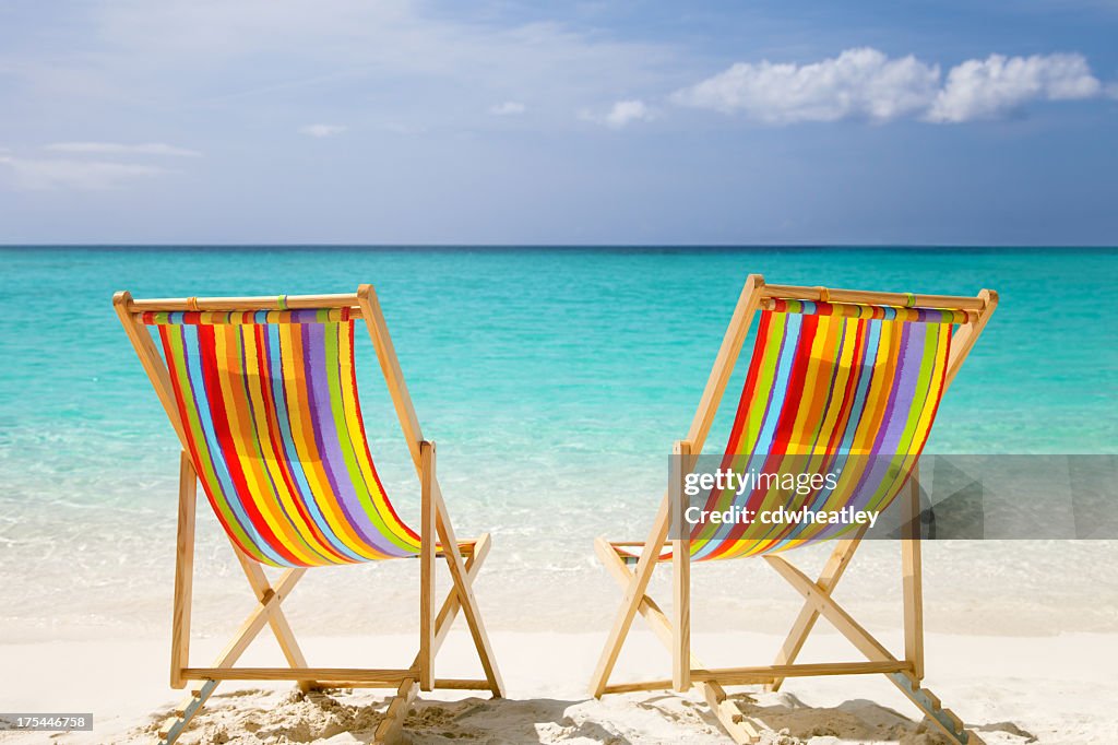 Colorful chairs at a topical Caribbean beach