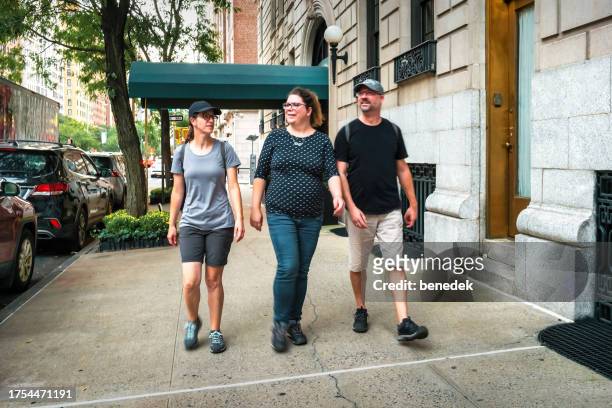 friends explore walk new york city - upper east side manhattan stock pictures, royalty-free photos & images