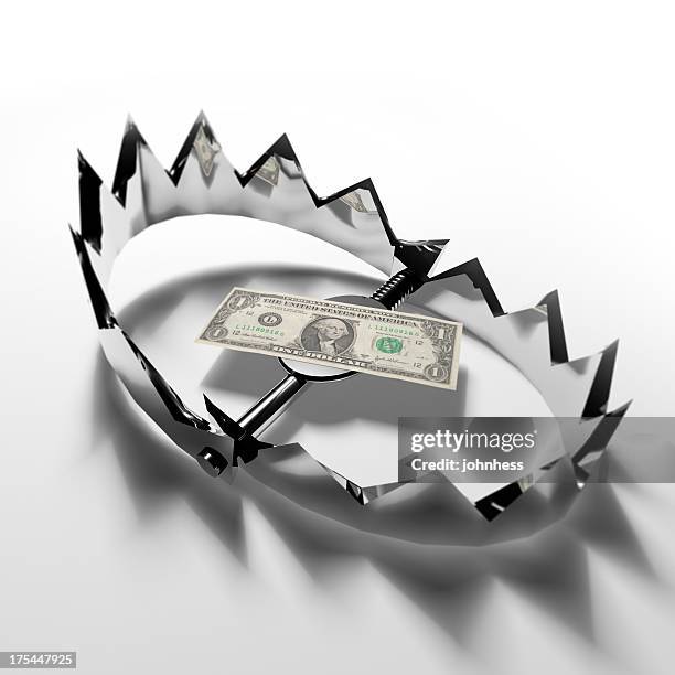 dollar bill in a bear trap - bear trap stock pictures, royalty-free photos & images