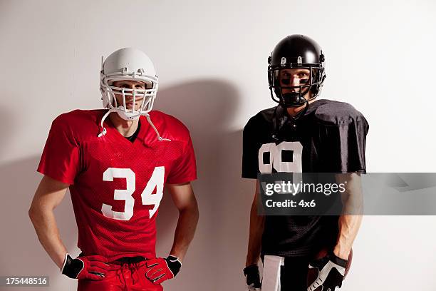 american football players - american football player white background stock pictures, royalty-free photos & images