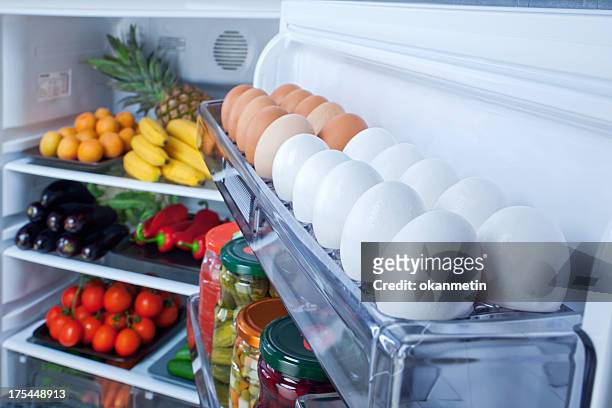 refrigerator - fridge full of food stockfoto's en -beelden