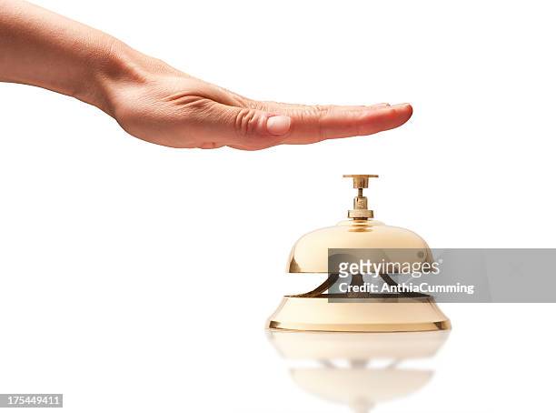 hand over service bell on white background - hand bell stock pictures, royalty-free photos & images